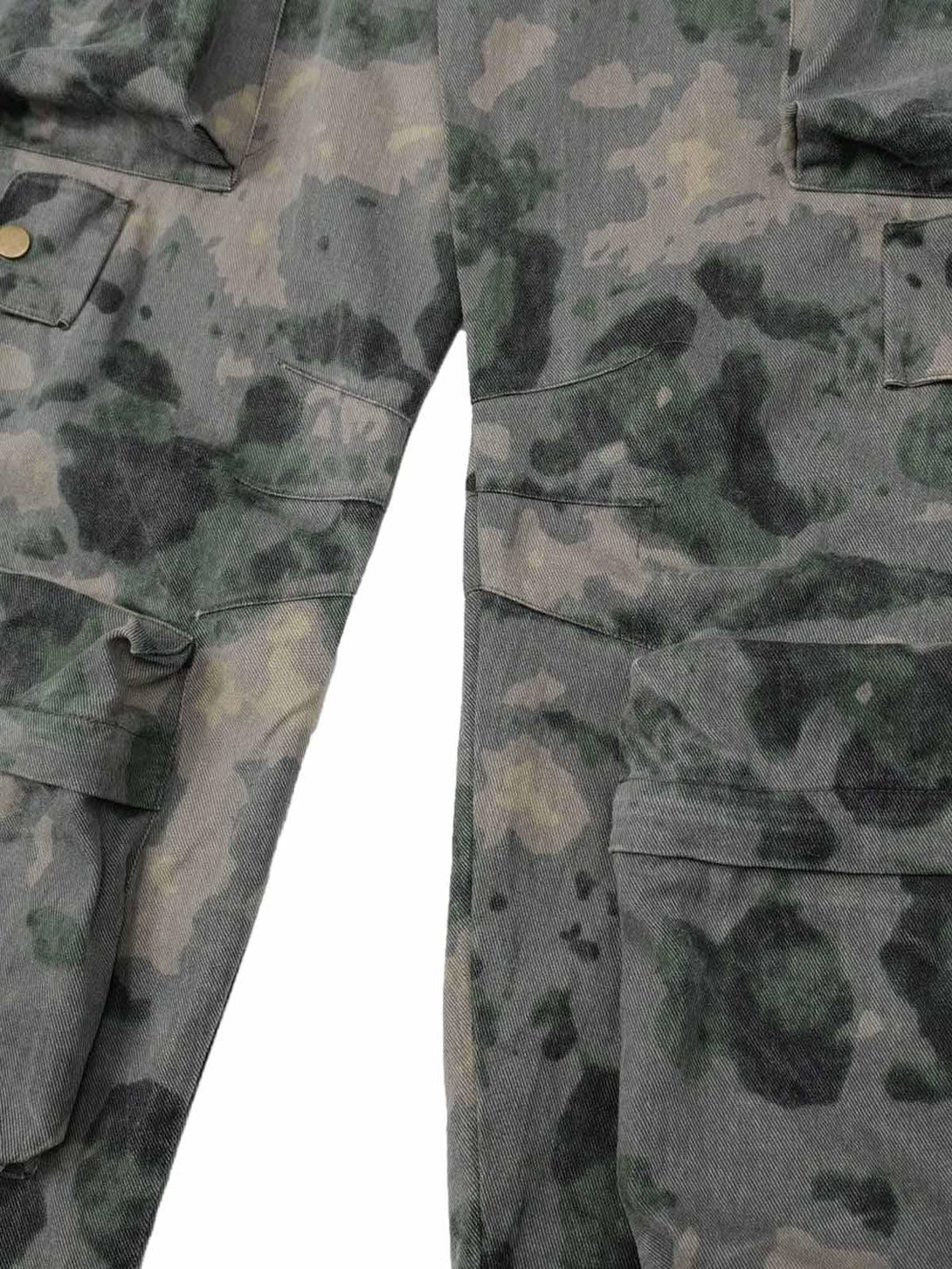 A tight crop highlighting TALISHKO cargo pants' camouflage pattern and pocket details.
