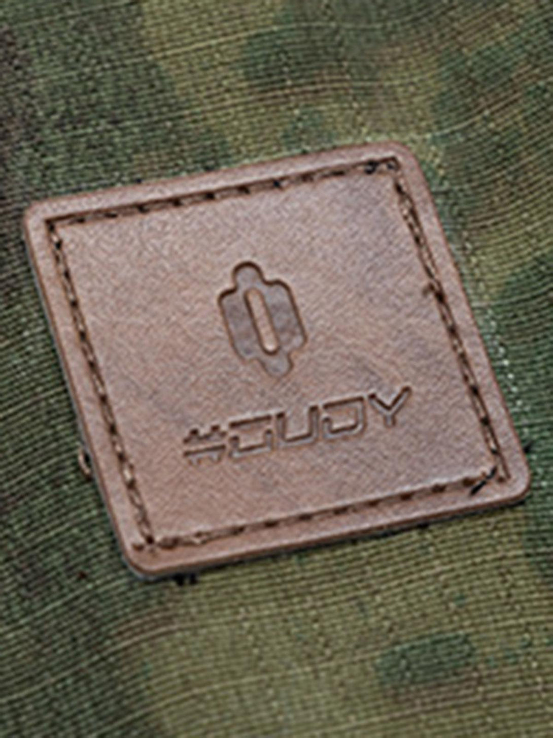 Detailed view of TALISHKO's camouflage jacket patch, highlighting its rugged texture and design.