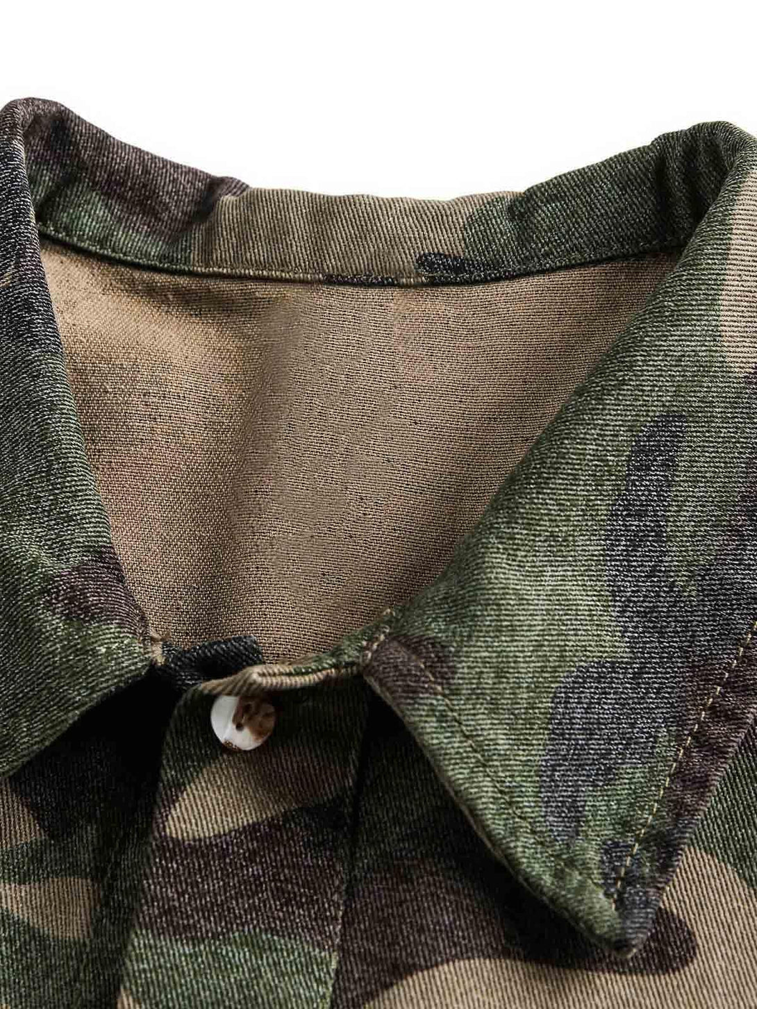Close-up of the TALISHKO camouflage shirt collar showcasing its intricate patchwork texture.