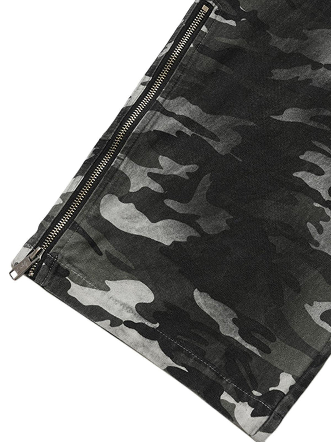 A detailed view of TALISHKO's camouflage cargo pants, highlighting the side zipper design.