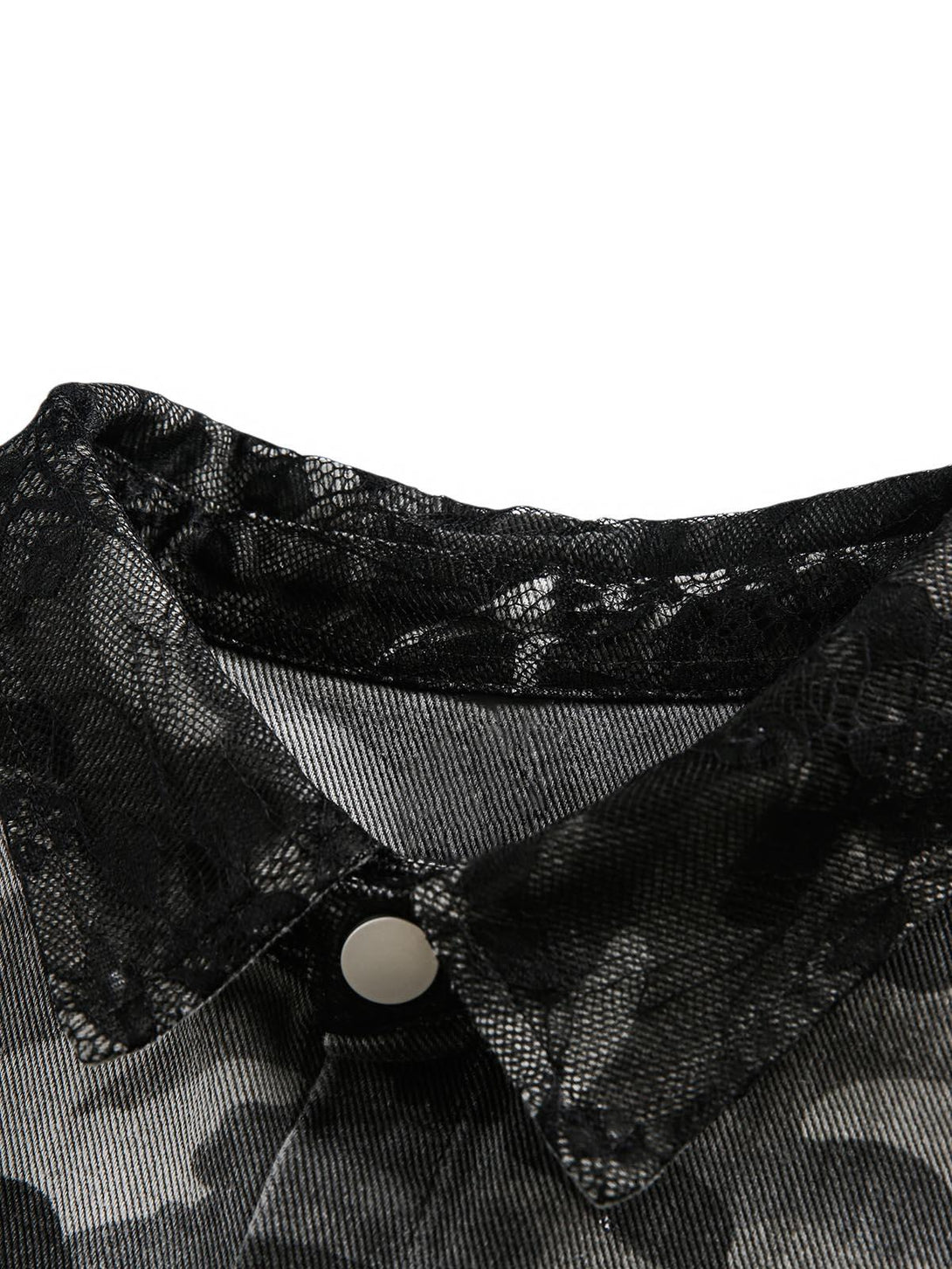 A detailed view of TALISHKO's camouflage denim shirt, highlighting lace and button details.