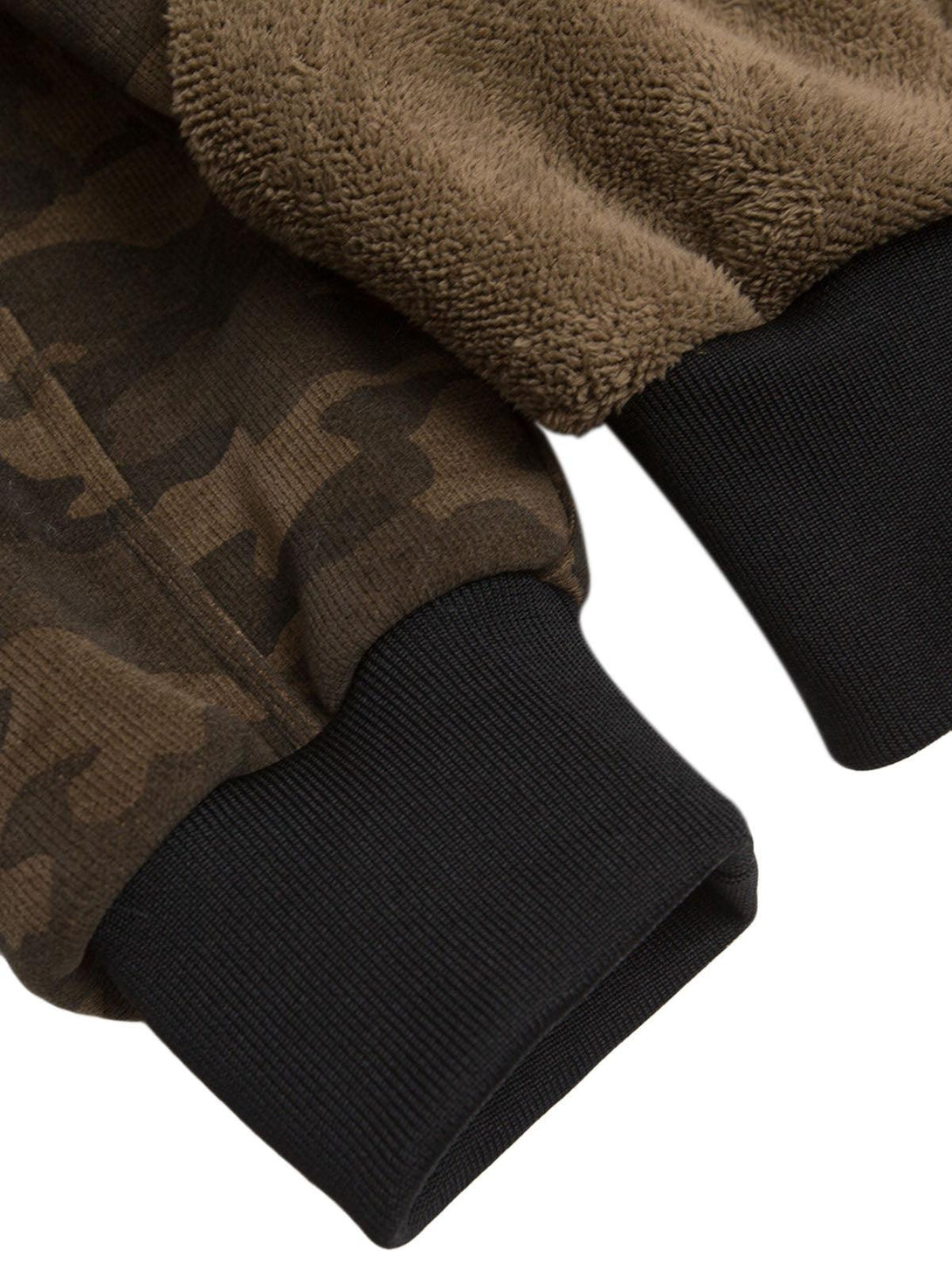 Intricate look at TALISHKO's camouflage and fur sleeve cuffs, highlighting texture contrast.