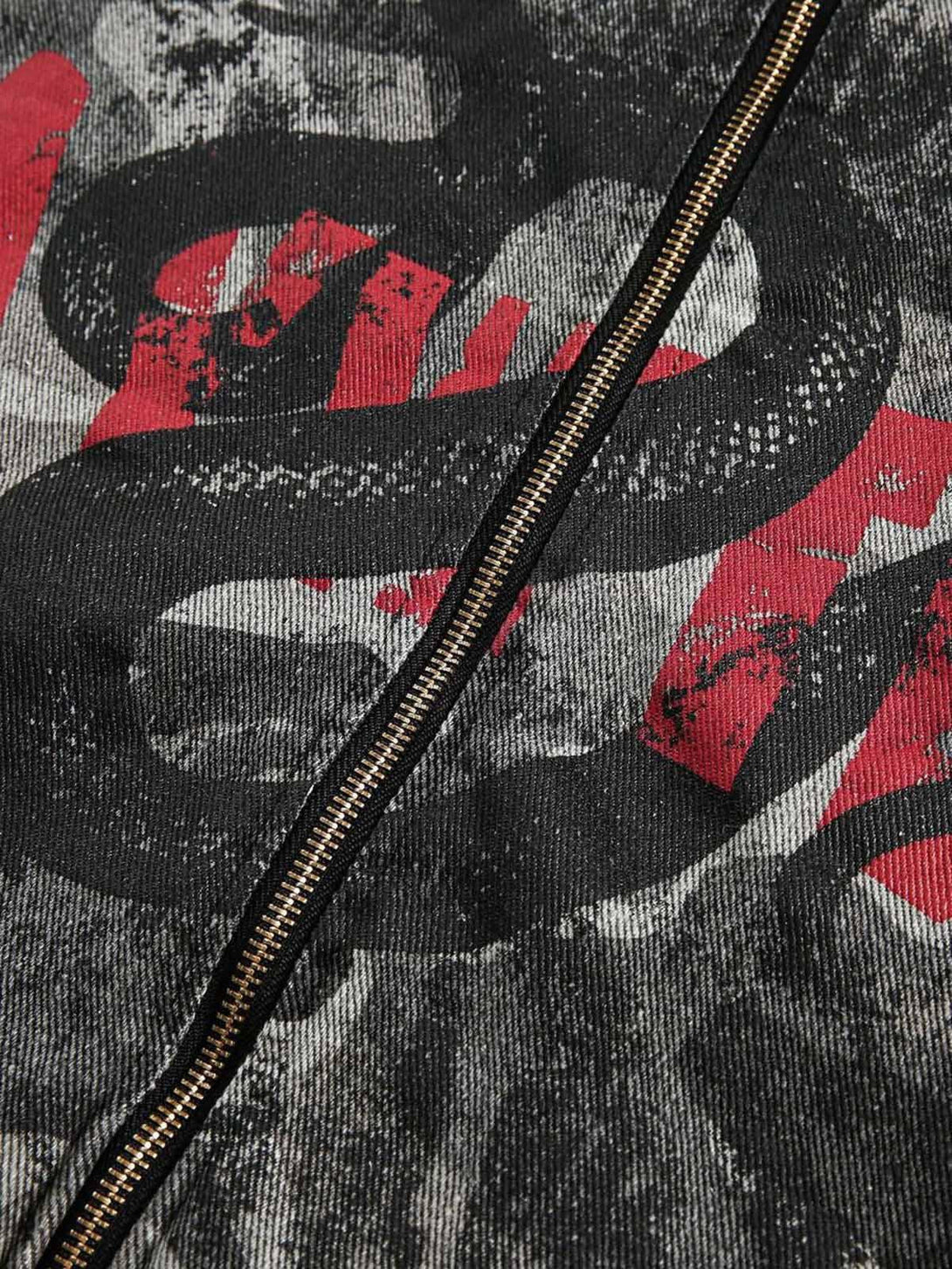 Intricate look at TALISHKO military jacket showcasing bold red and black graphic details.