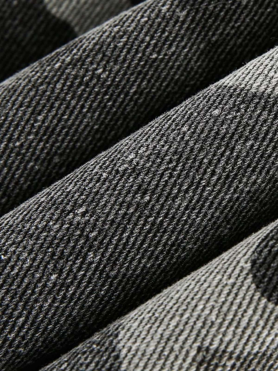 Texture and pattern showcased on TALISHKO camouflage military jacket, emphasizing its rugged weave.