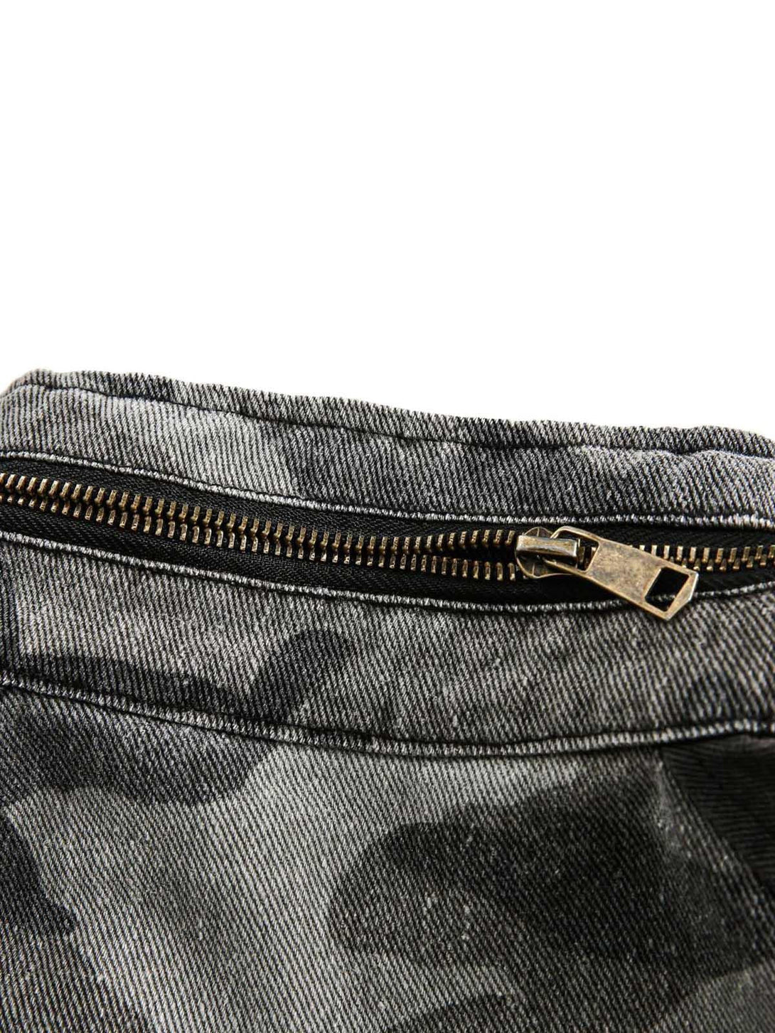 A tight crop highlighting the zipper detail on the TALISHKO camouflage military jacket.