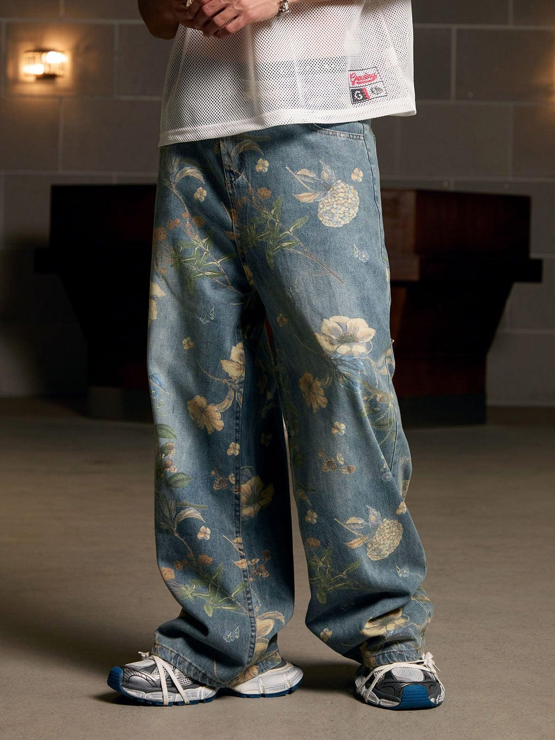 TALISHKO's floral carpenter pants, featuring a relaxed fit and detailed botanical patterns.