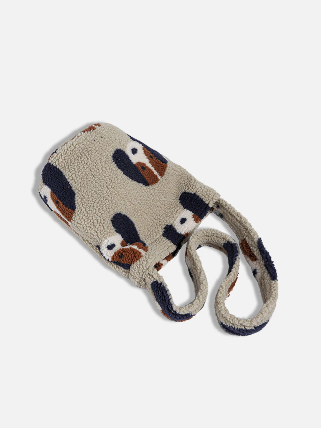 Plush bag by TALISHKO with cartoon dog pattern, highlighting its cozy texture and playful design.