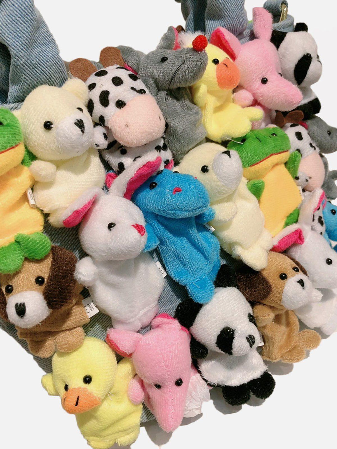 A playful TALISHKO bag featuring vibrant cartoon animal dolls, adding a whimsical touch.