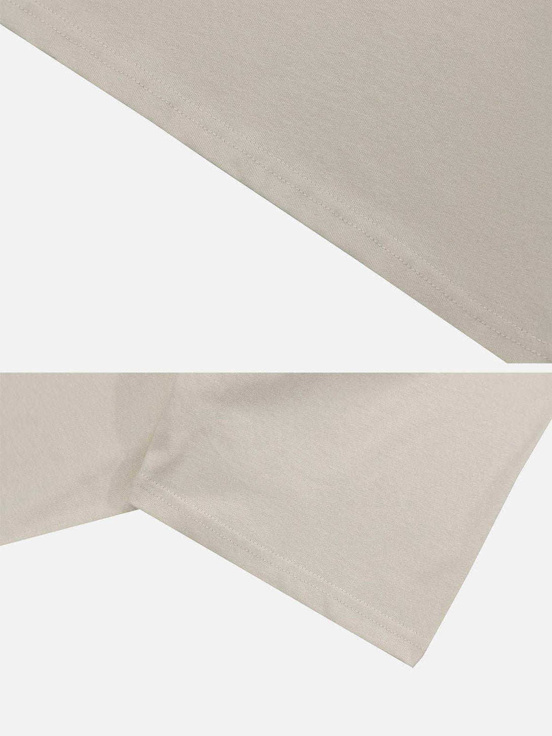 Detailed fabric and stitching on TALISHKO graphic tee with playful cartoon design.