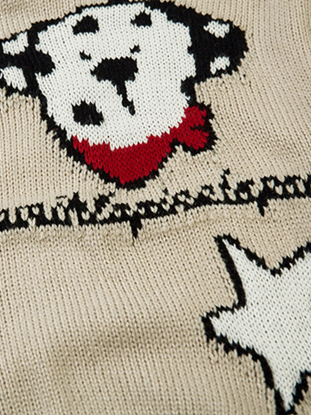 Zoomed-in texture of cartoon pet design on a knitted cardigan by TALISHKO.