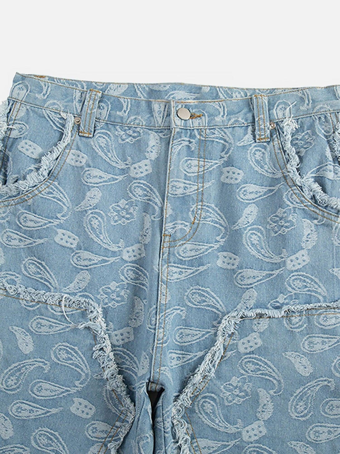 Zoomed-in texture of TALISHKO's cashew flower cut jeans highlighting the paisley design.