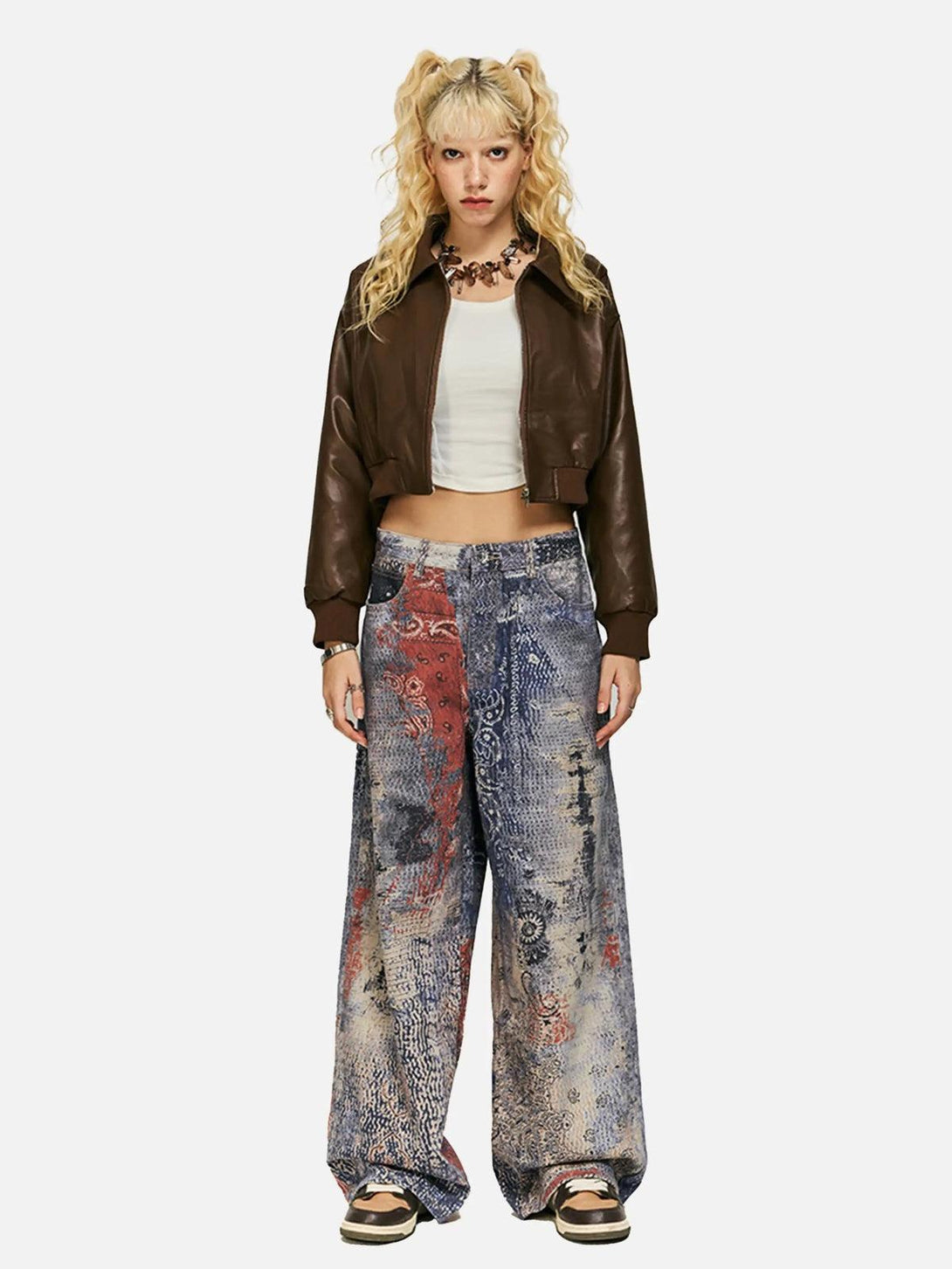 Model in TALISHKO's digital print imitation jeans, paired with a brown jacket and white top.