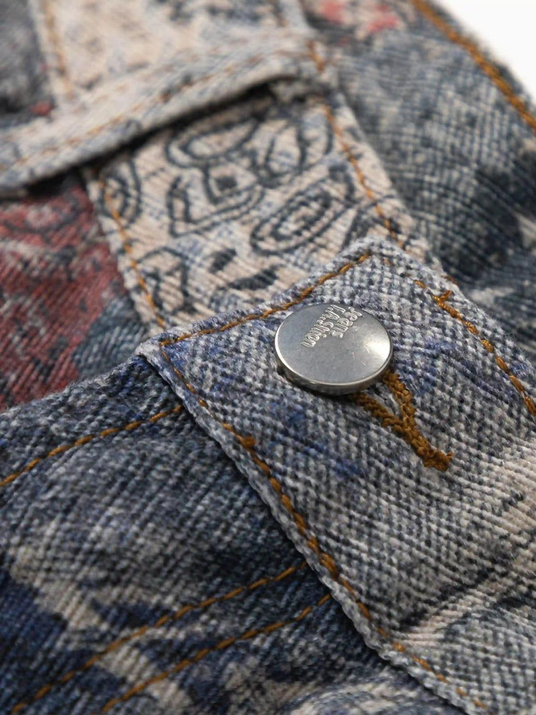 Detailed look at TALISHKO's imitation jeans showcasing intricate digital print and stitching.