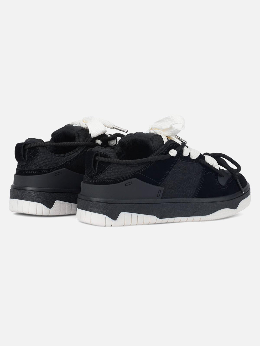 Back view of TALISHKO sports shoes in black with white laces, showcasing casual versatility.