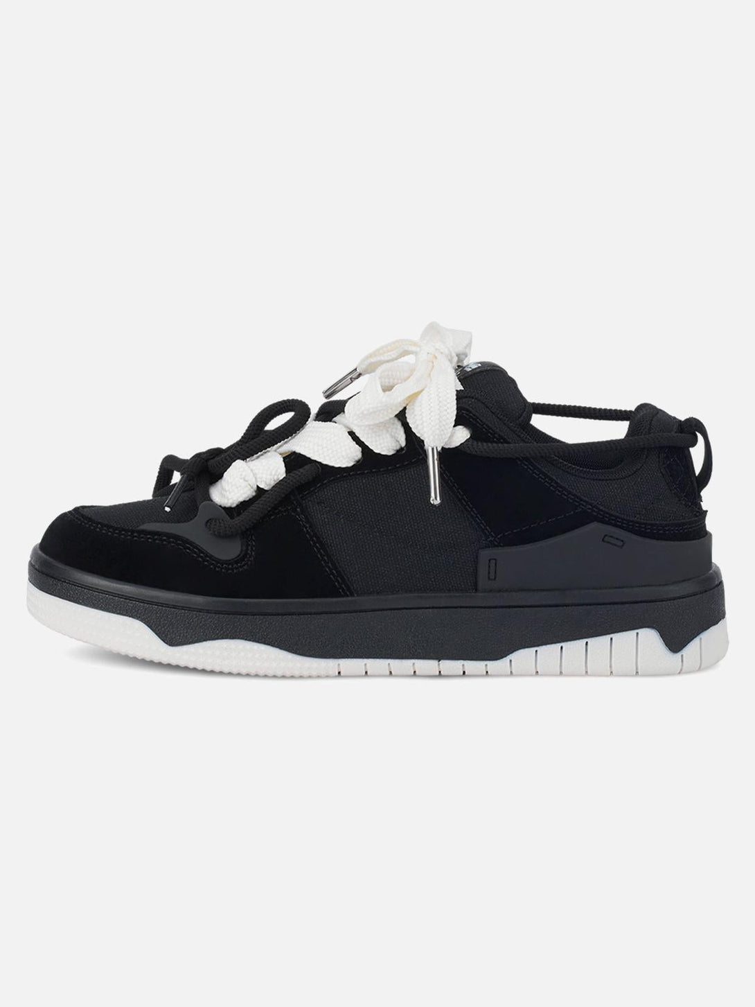 Side view of TALISHKO sports shoes in black with bold white laces, ideal for versatile styling.