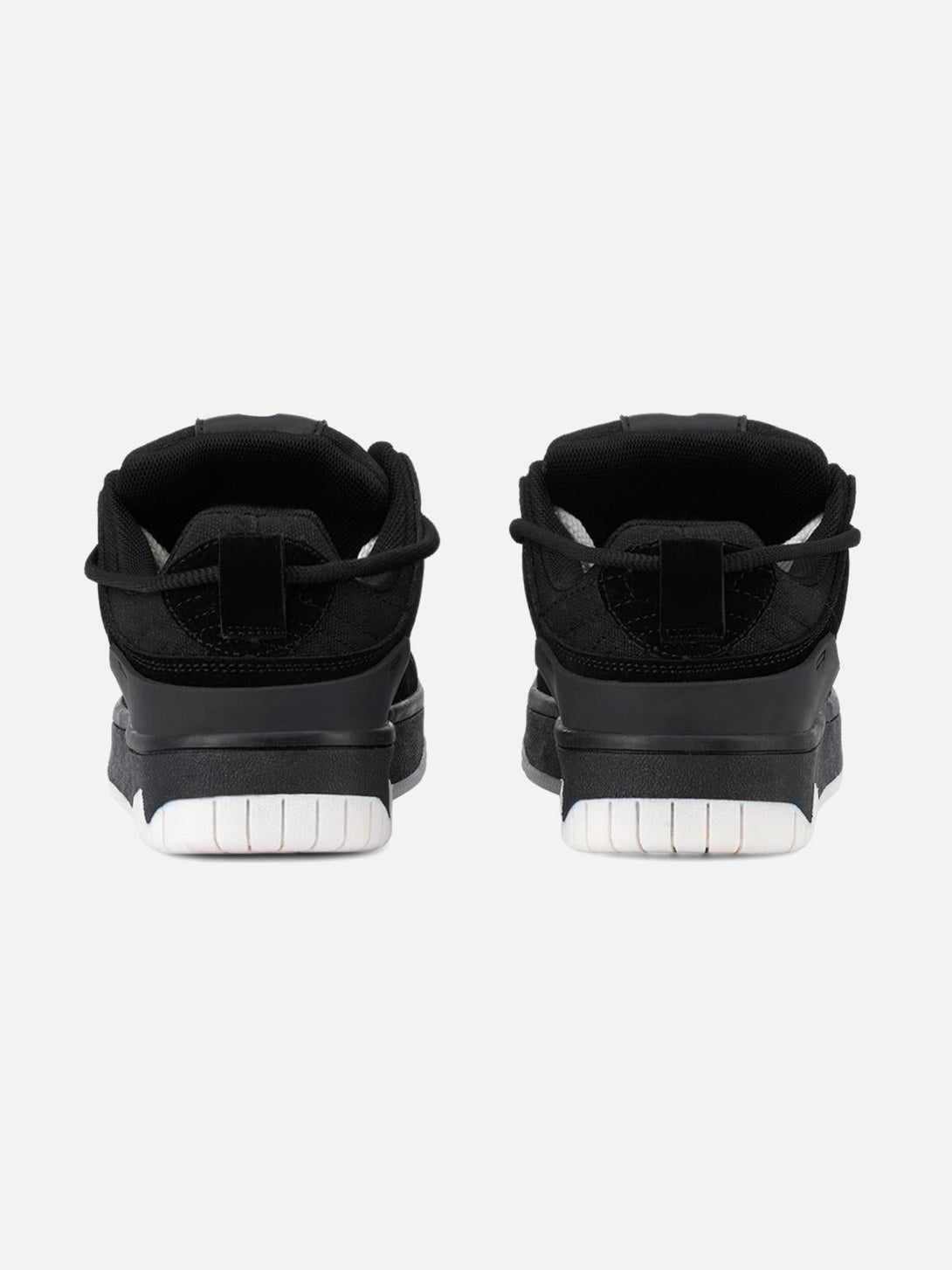 Back view of TALISHKO sports shoes in black, featuring a sleek design with white soles.