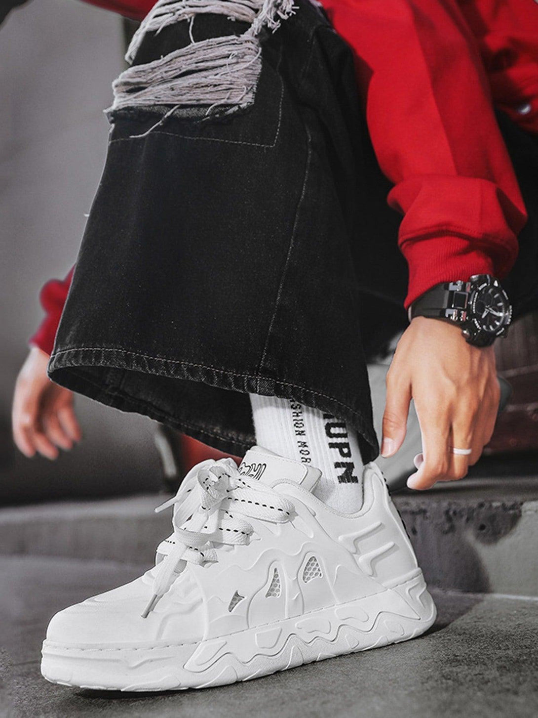 White casual plate shoes by TALISHKO, side view featuring stylish urban design with black jeans.