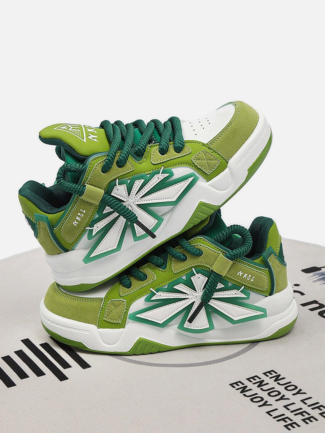 Green casual preppy sneakers by TALISHKO, featuring a bold star design and vibrant laces.