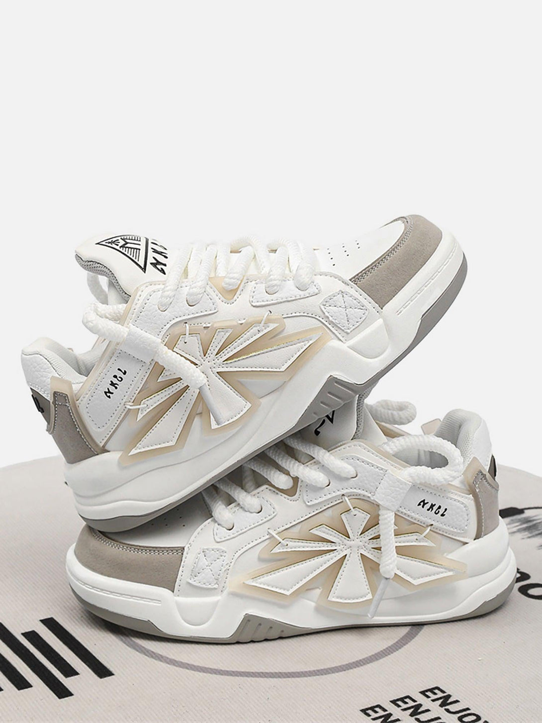 White casual preppy sneakers by TALISHKO, featuring a bold star design and textured details.