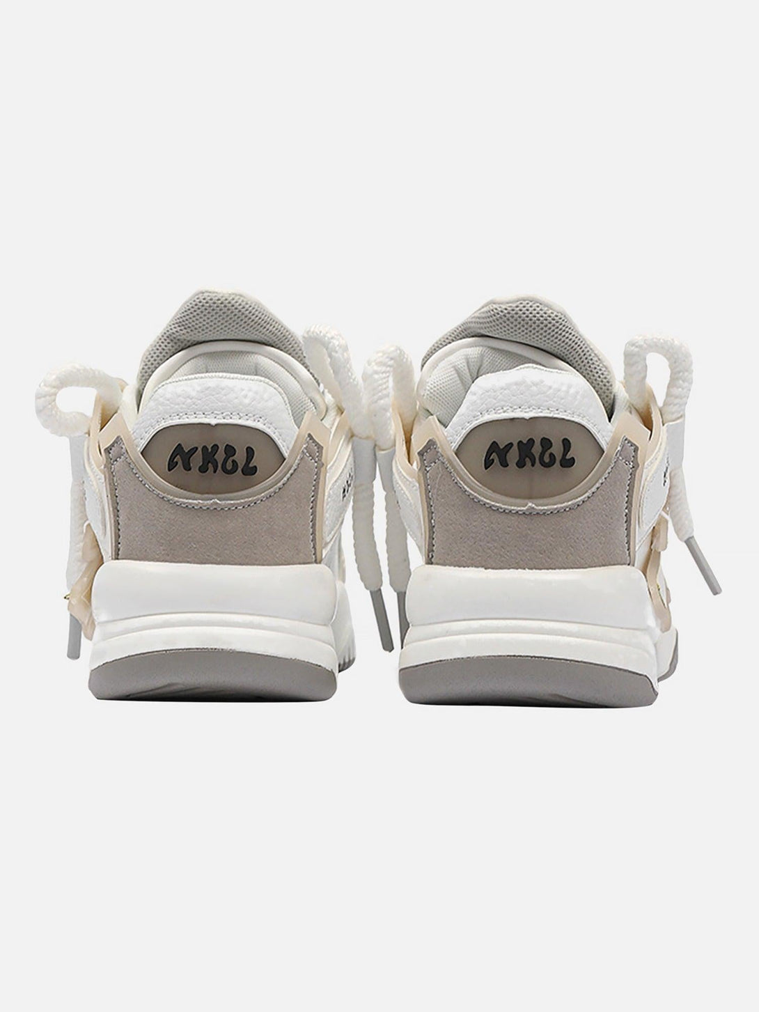 Rear view of TALISHKO casual preppy sneakers, featuring a chic gray and white design.