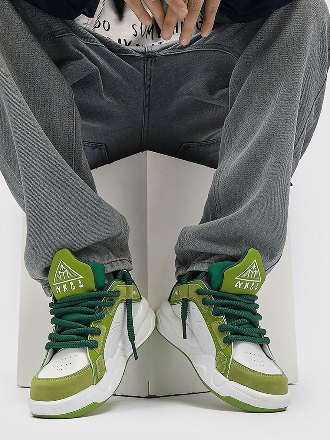 Green preppy sneakers by TALISHKO, worn with relaxed jeans for a stylish streetwear look.