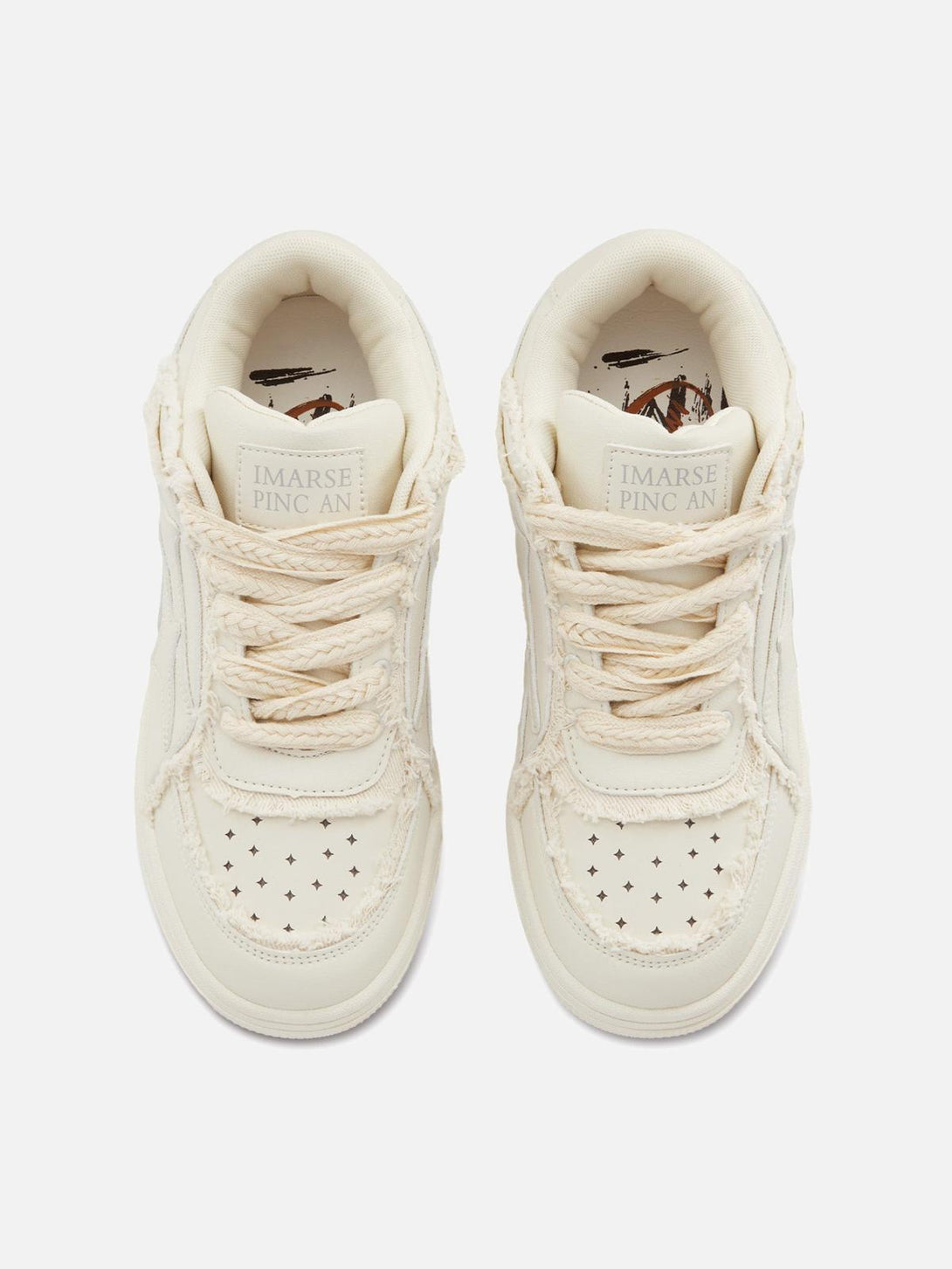 Top view of TALISHKO casual white board shoes with textured laces and perforated design.