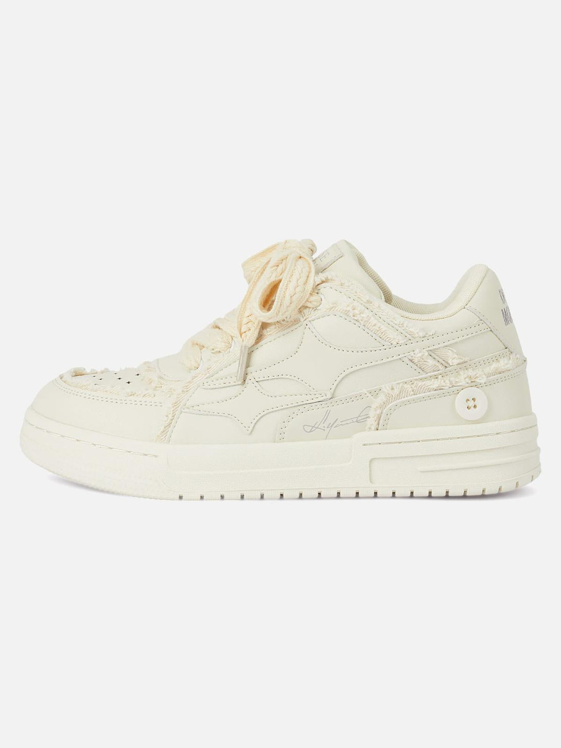 Side view of TALISHKO casual white board shoes with unique textured details.