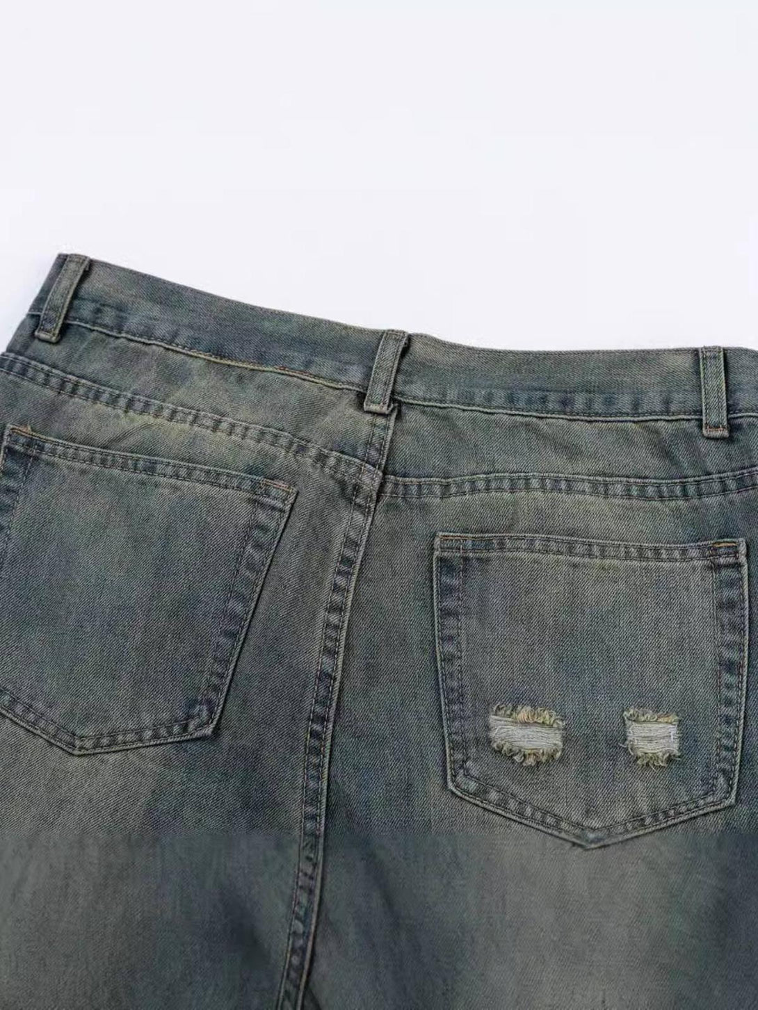 Back view of TALISHKO cat graffiti print jeans, highlighting distressed pocket details.