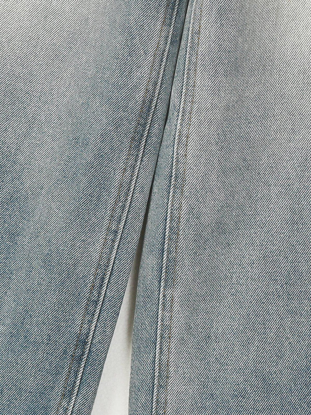 TALISHKO's jeans showcase detailed stitching and faded wash for a contemporary look.