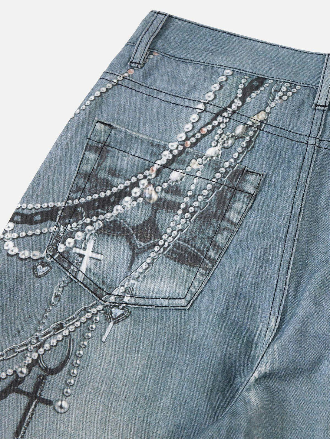Intricate look at the chain print detail on TALISHKO jeans, highlighting unique style elements.