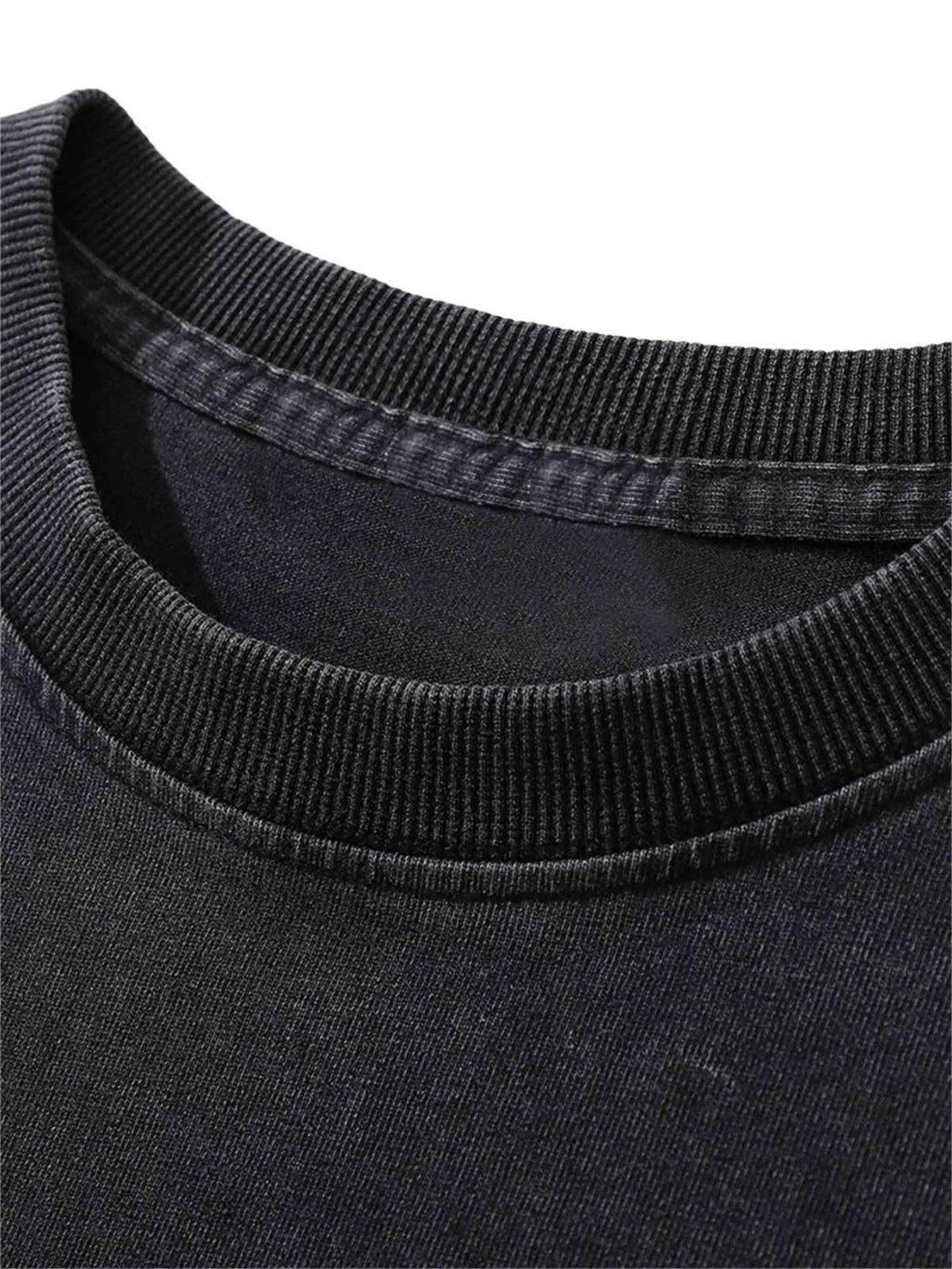 Focusing on the ribbed neckline of a black washed t-shirt by TALISHKO, highlighting texture.