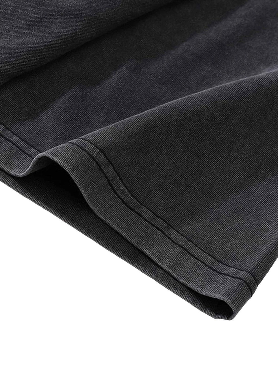 A detailed view of TALISHKO's washed and aged t-shirt fabric, showcasing its texture.