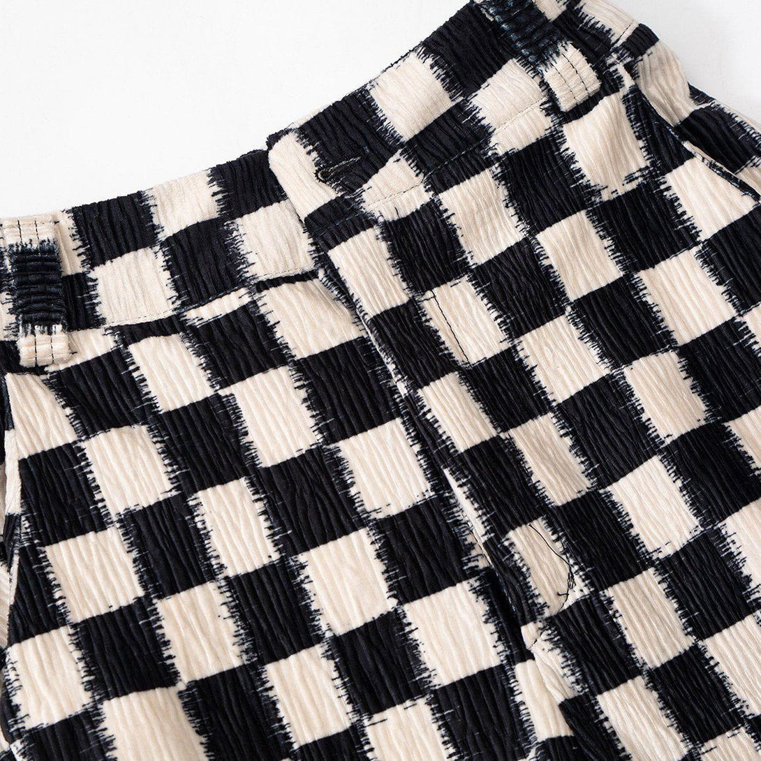 Checkerboard pattern detail on TALISHKO pants, highlighting the textured fabric and design.