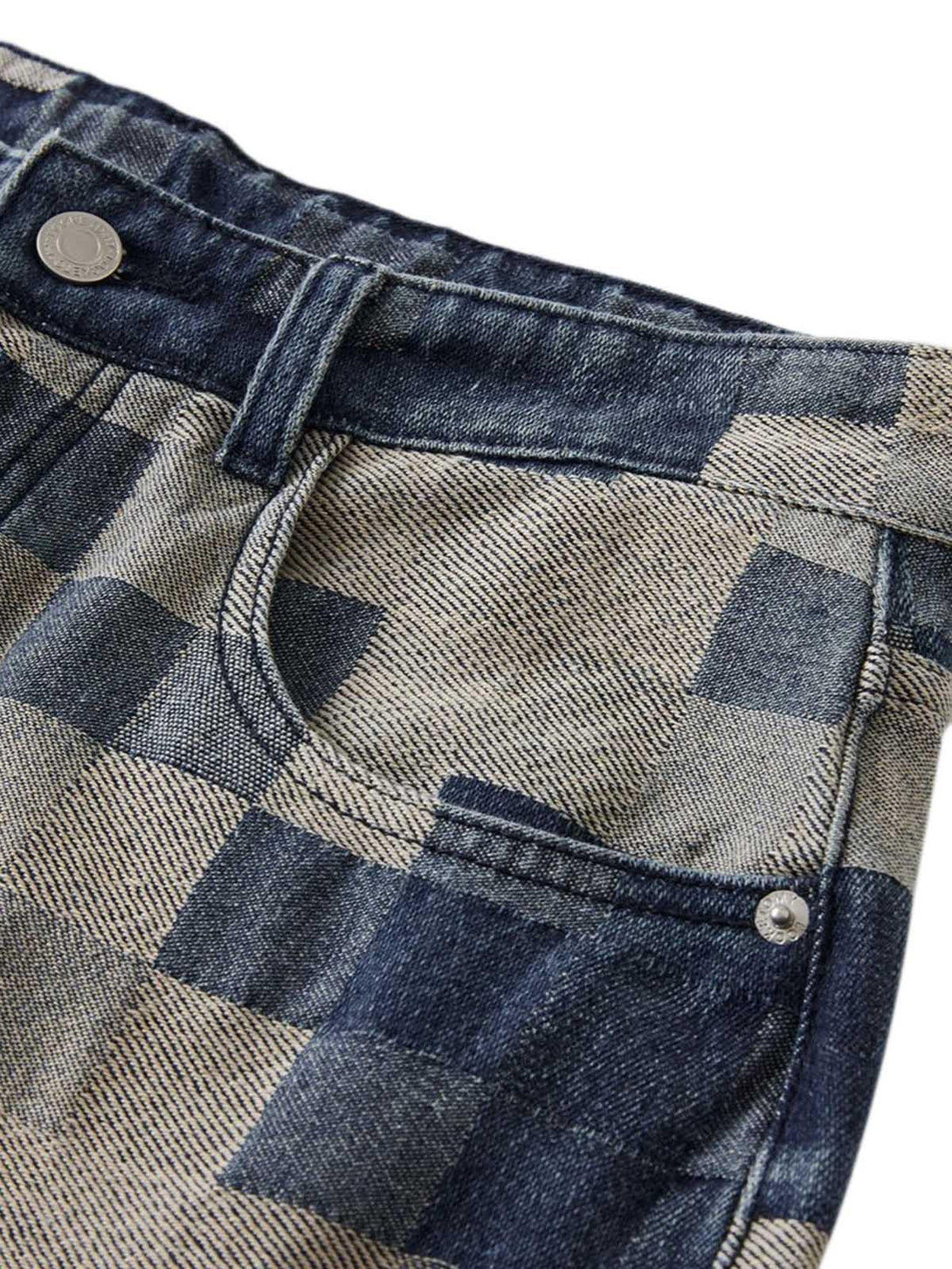 Detailed fabric and stitching on TALISHKO checkerboard jacquard wide-leg jeans pocket.