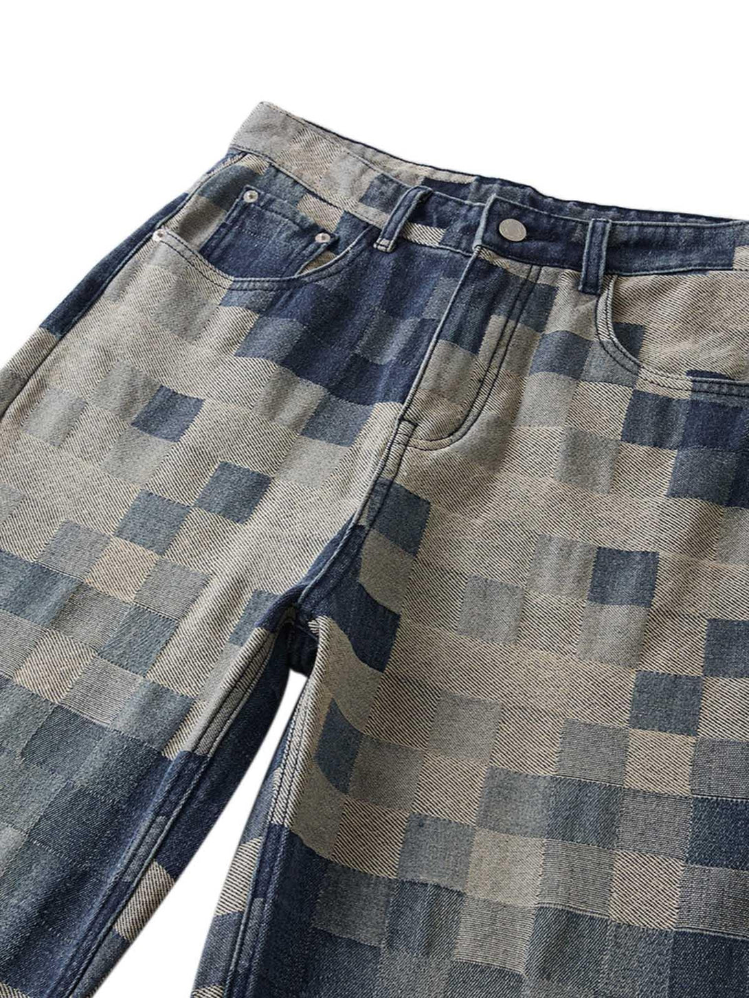 Zoomed-in texture of TALISHKO checkerboard jacquard wide-leg jeans fabric detail.