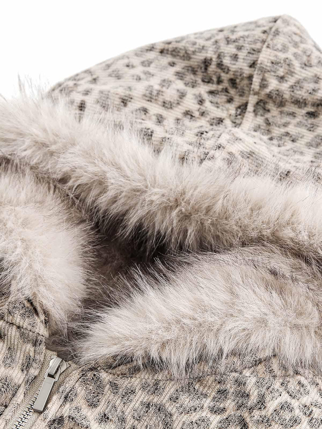 Focusing on the soft mink fur trim of the cheetah print hooded jacket by TALISHKO.