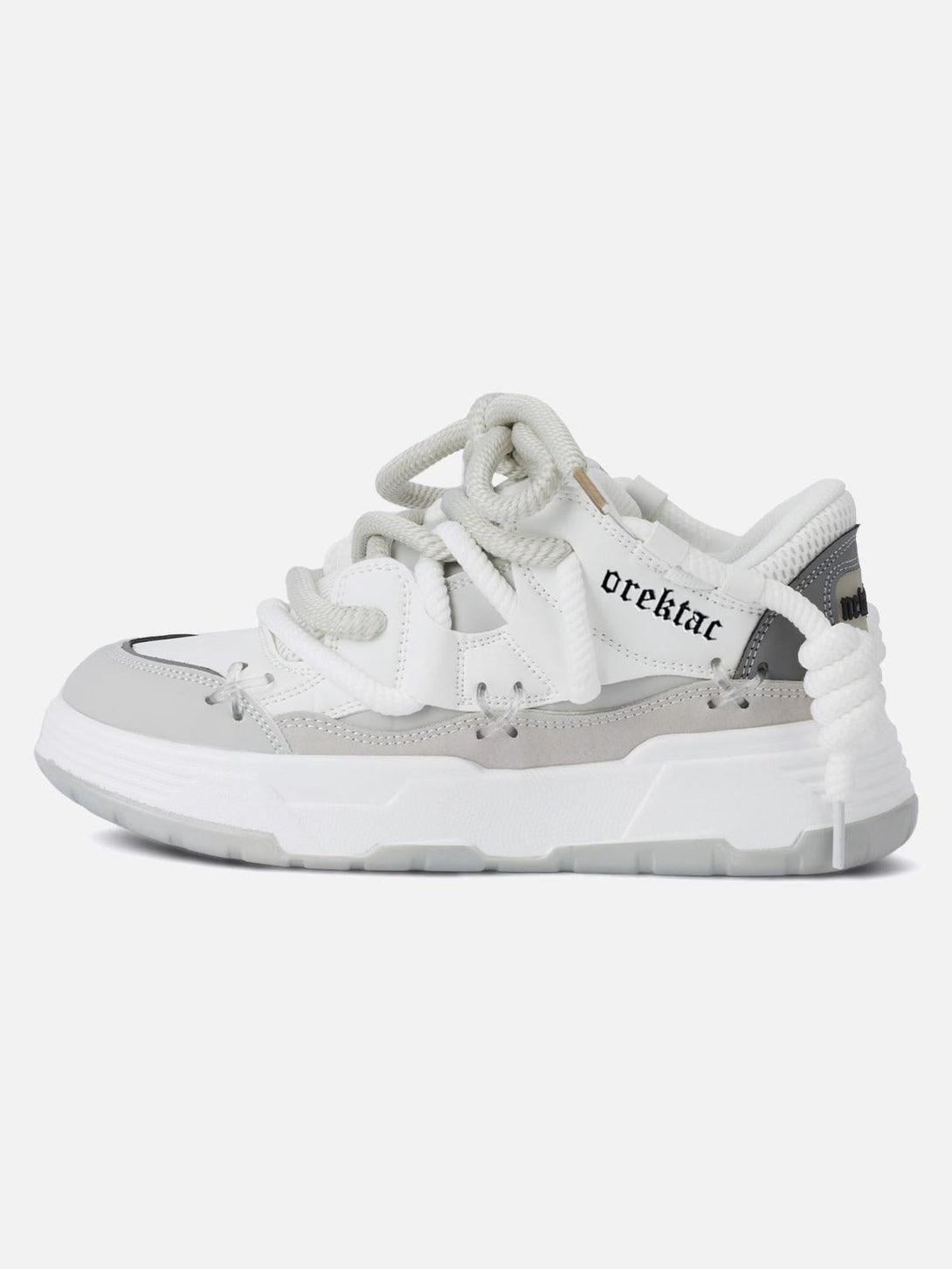 Side view of white chunky rope shoes by TALISHKO, featuring unique lacing and design elements.