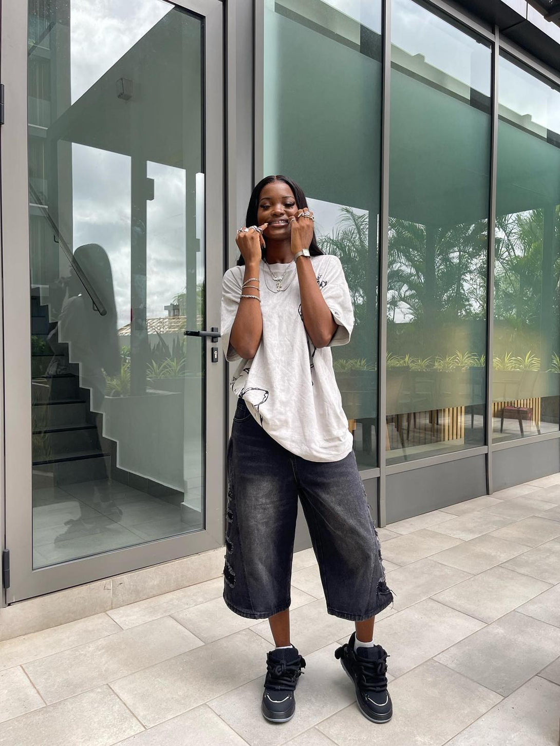 Model in casual streetwear with black chunky rope shoes by TALISHKO, embracing urban vibes.