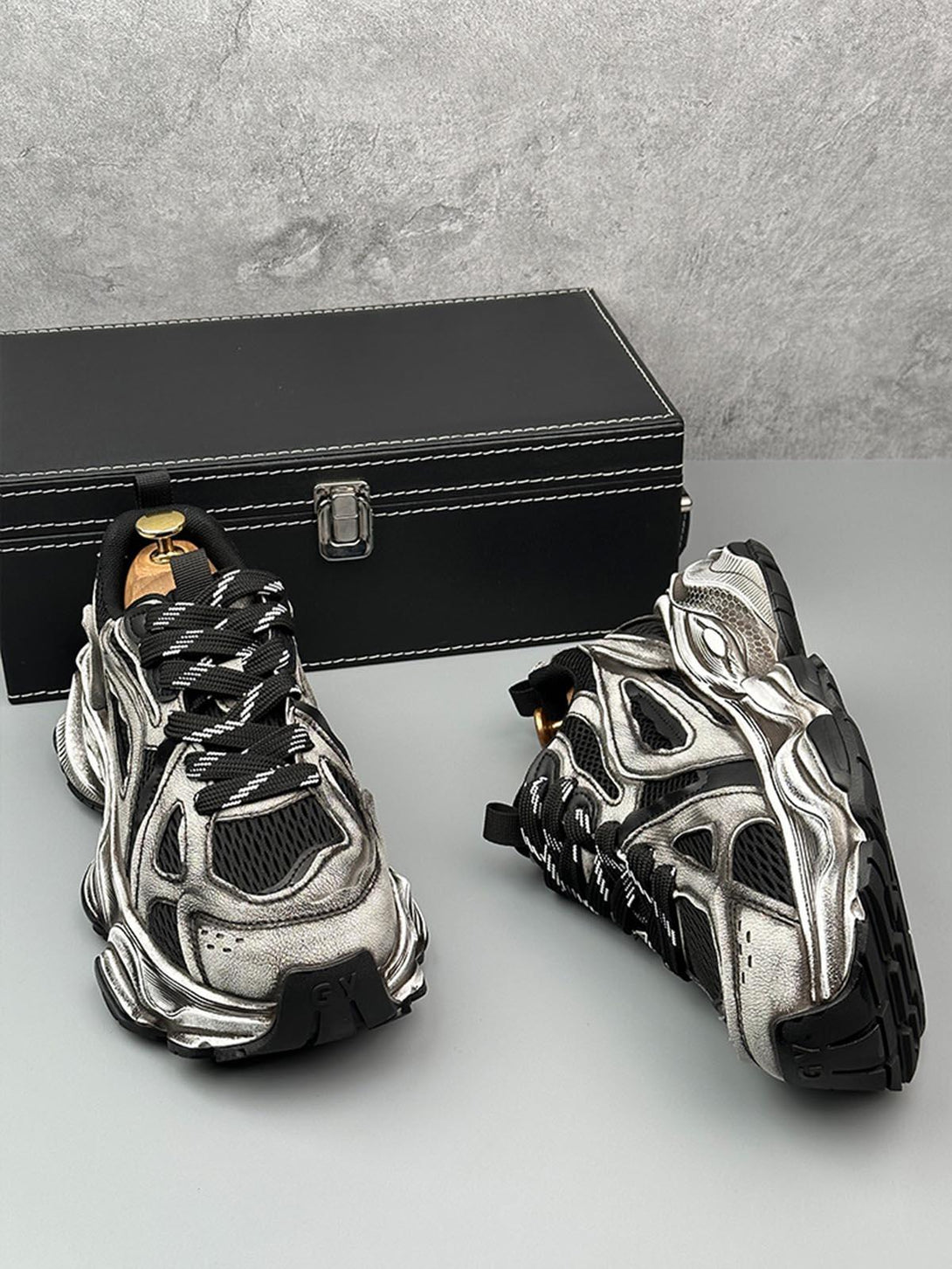 TALISHKO chunky sole sneakers in metallic, featuring bold design and breathable mesh accents.