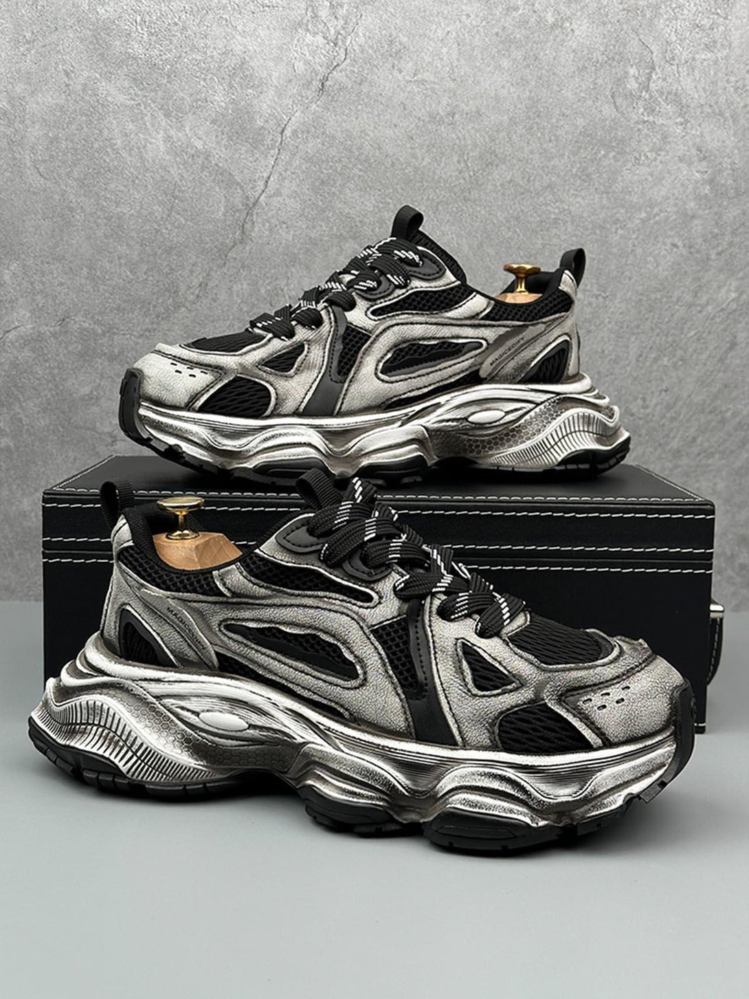 Chunky sole running sneakers by TALISHKO, featuring a striking metallic design and breathable mesh.