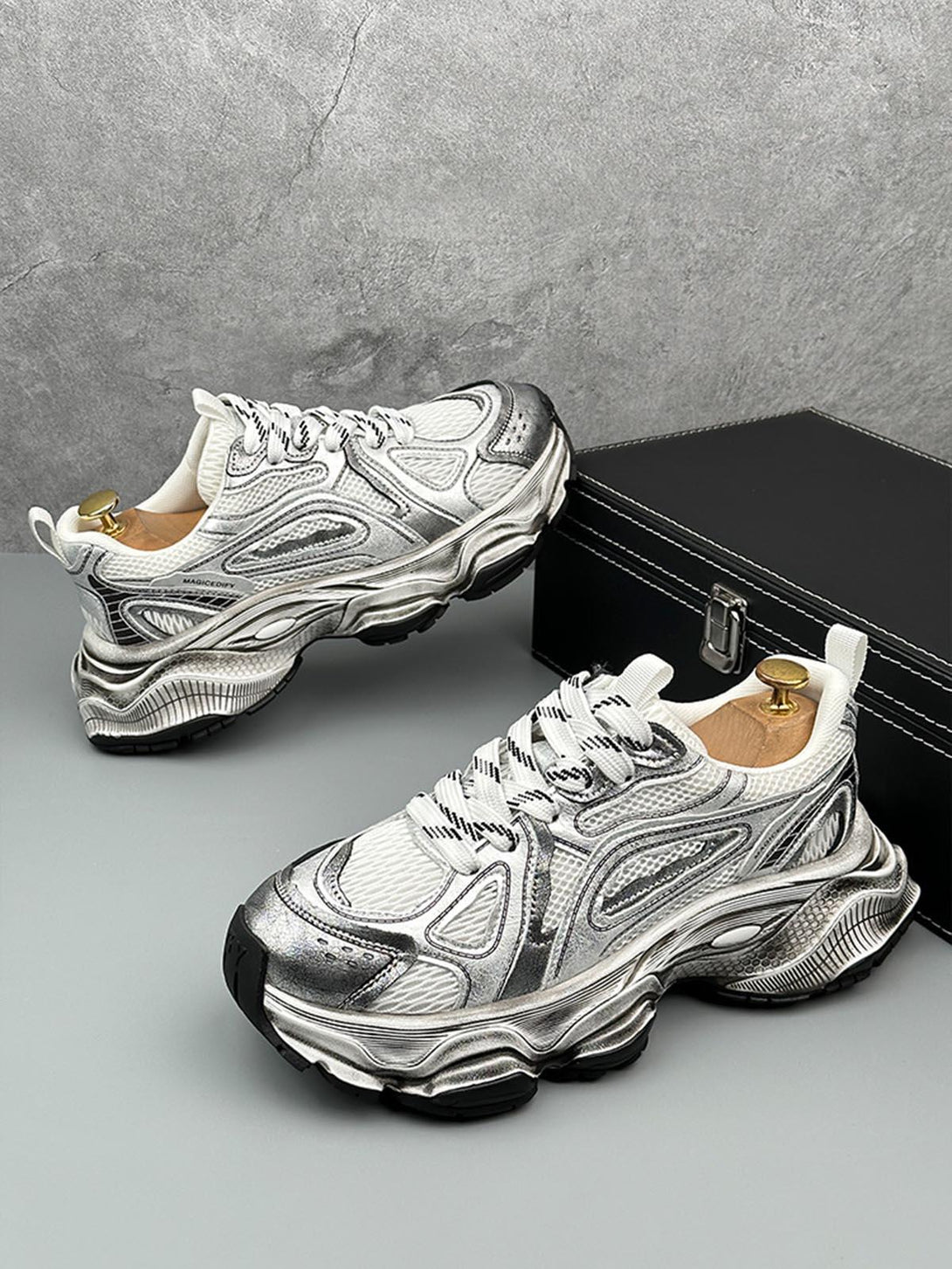 TALISHKO chunky sole sneakers in metallic, side view highlighting bold design and breathable mesh.