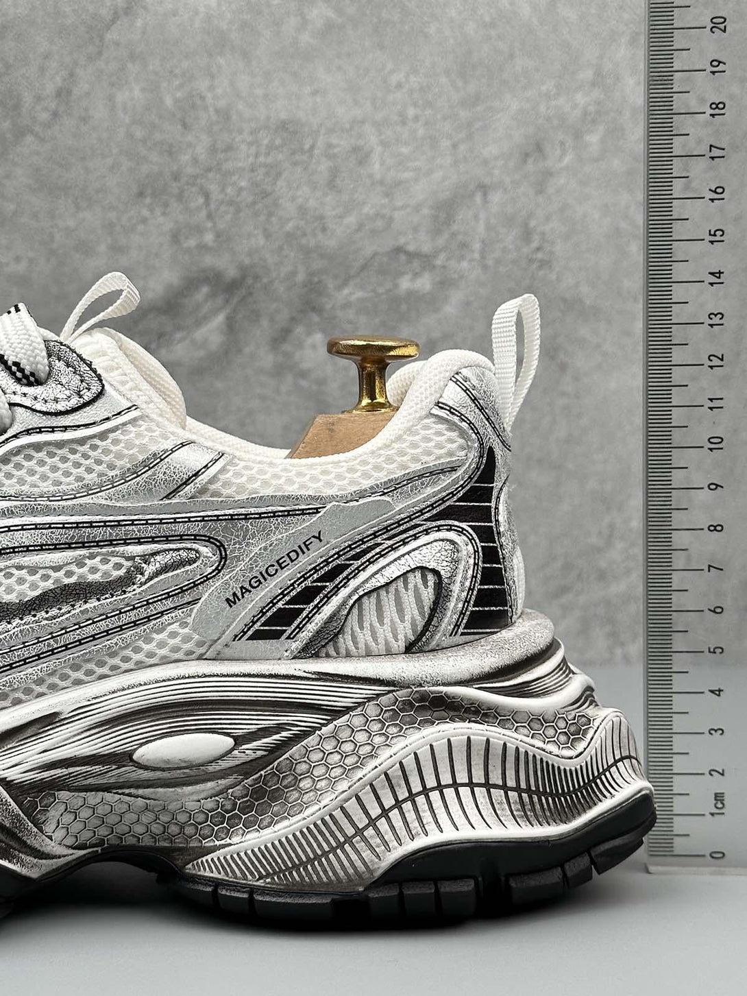 Close-up of TALISHKO's chunky sole sneakers, highlighting intricate design and textured details.