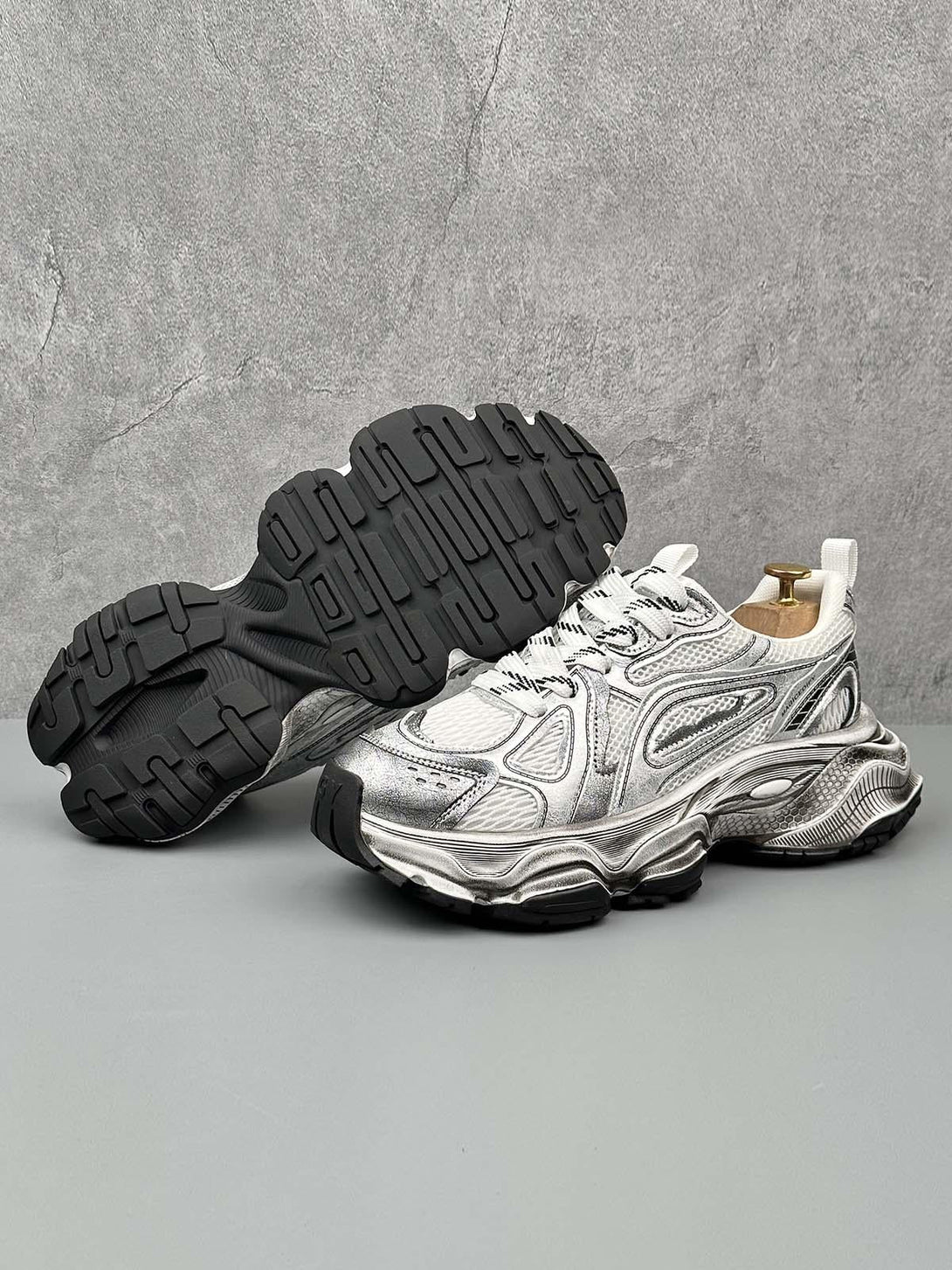 TALISHKO chunky sole sneakers in metallic, showing intricate sole design and breathable material.