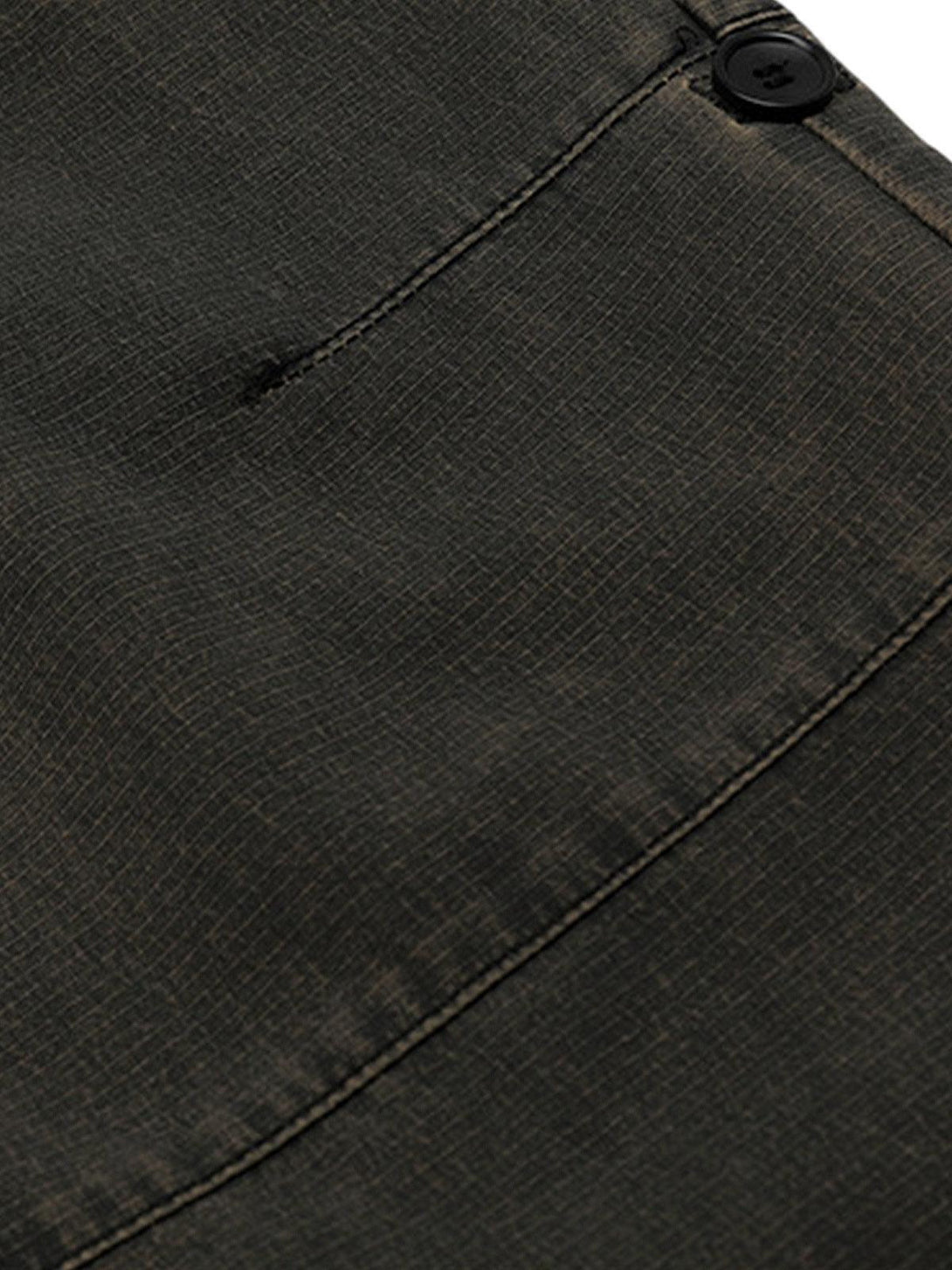 Intricate look at the fabric and button detail of TALISHKO's classic cargo pants.