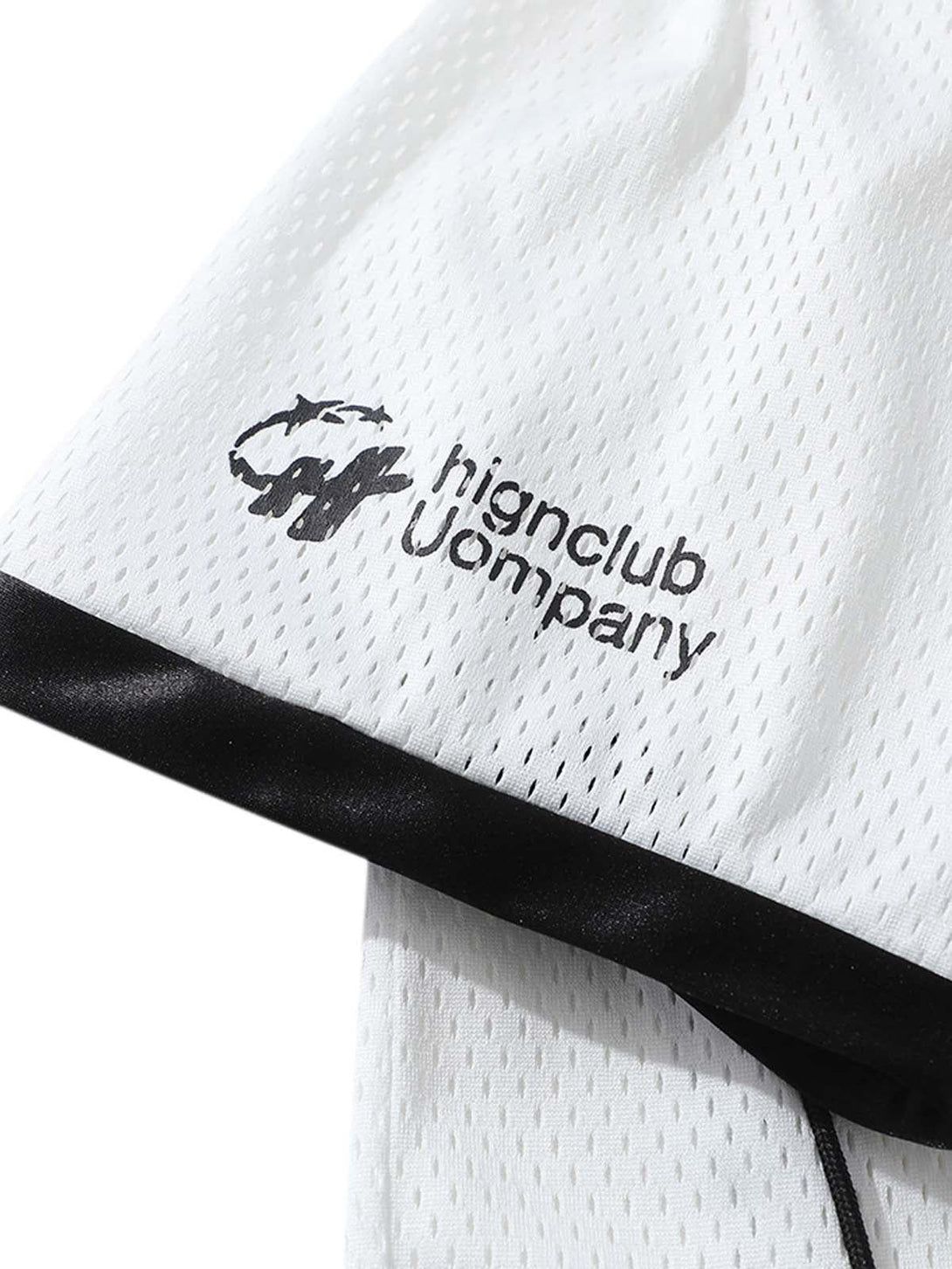 Focusing on the mesh texture and logo detail of a Classic Sports Jersey T-Shirt by TALISHKO.