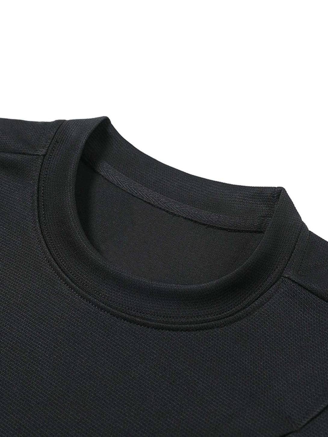 A tight crop highlighting the neckline and texture of a black T-shirt by TALISHKO.