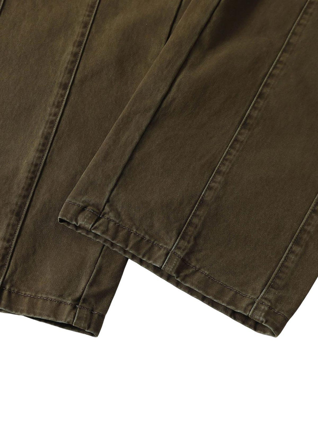 Intricate look at TALISHKO's utility cargo pants, highlighting detailed stitching and texture.