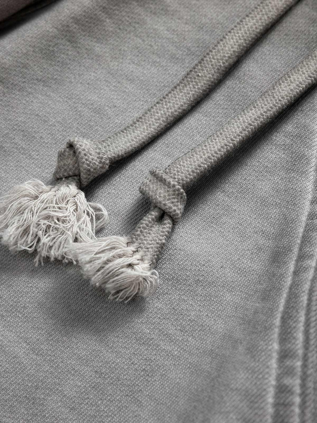 TALISHKO's velour cargo shorts feature a close-up of the textured drawstring and soft fabric.