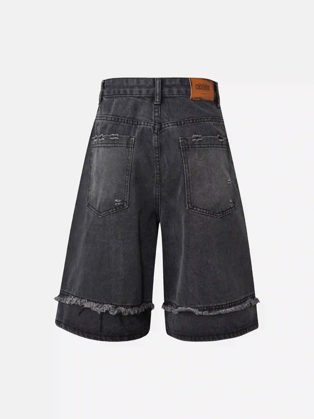 Back view of black denim jorts by TALISHKO, featuring frayed hems and patchwork details.