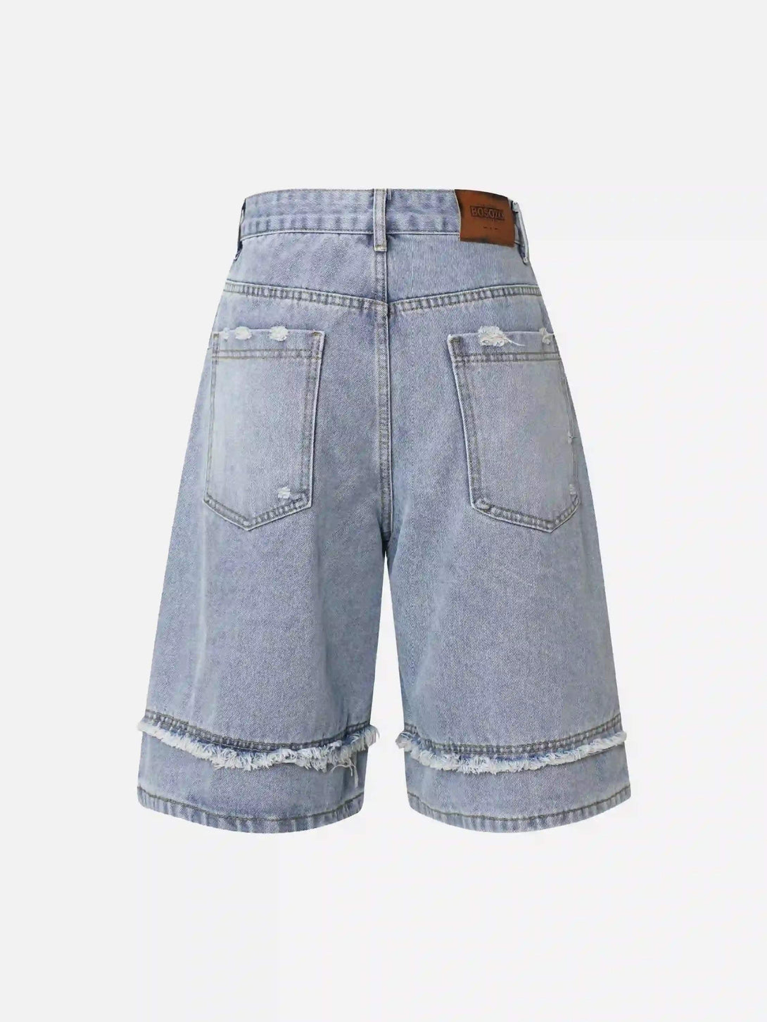 Back view of light blue denim jorts by TALISHKO, featuring frayed hems and patchwork accents.